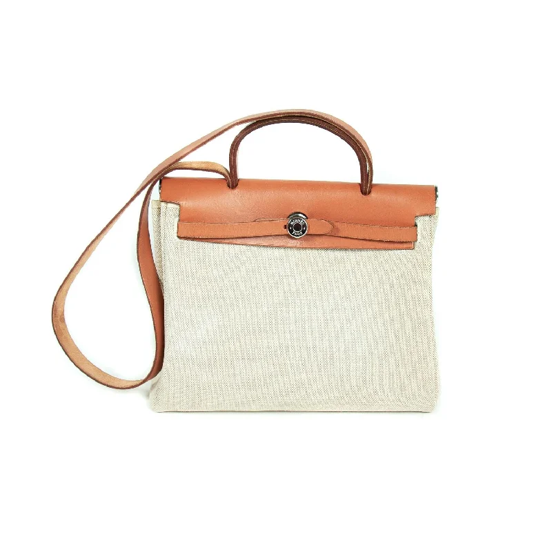 Large shoulder bags with ample storage for traveling or weekend getaways -Hermès Herbag PM Toile Beige